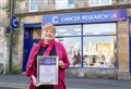 Loyal Elgin charity shop worker recognised for 25 years service to Cancer Research UK 