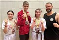 Sansum Martial Arts trio win medals at International Kickboxing Open