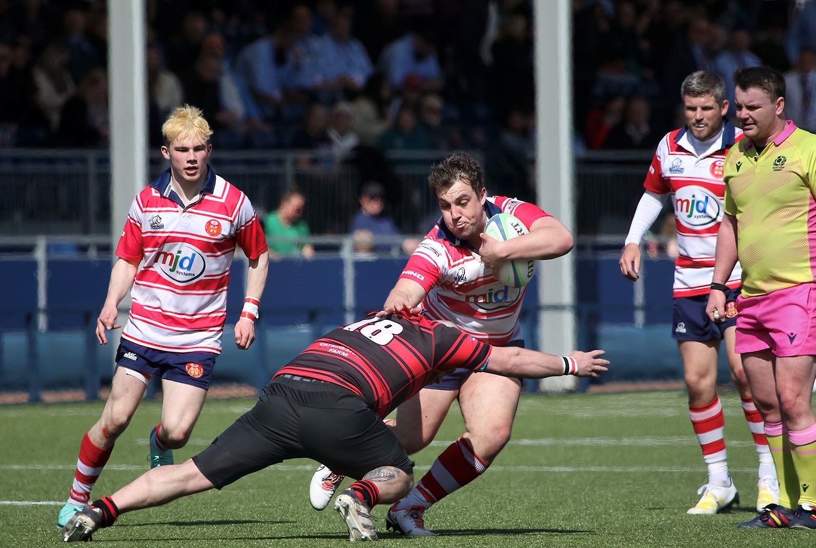 Cameron Hughes tries to break tackle, backed up by Lewis Hay and David Clarke. Picture: John MacGregor
