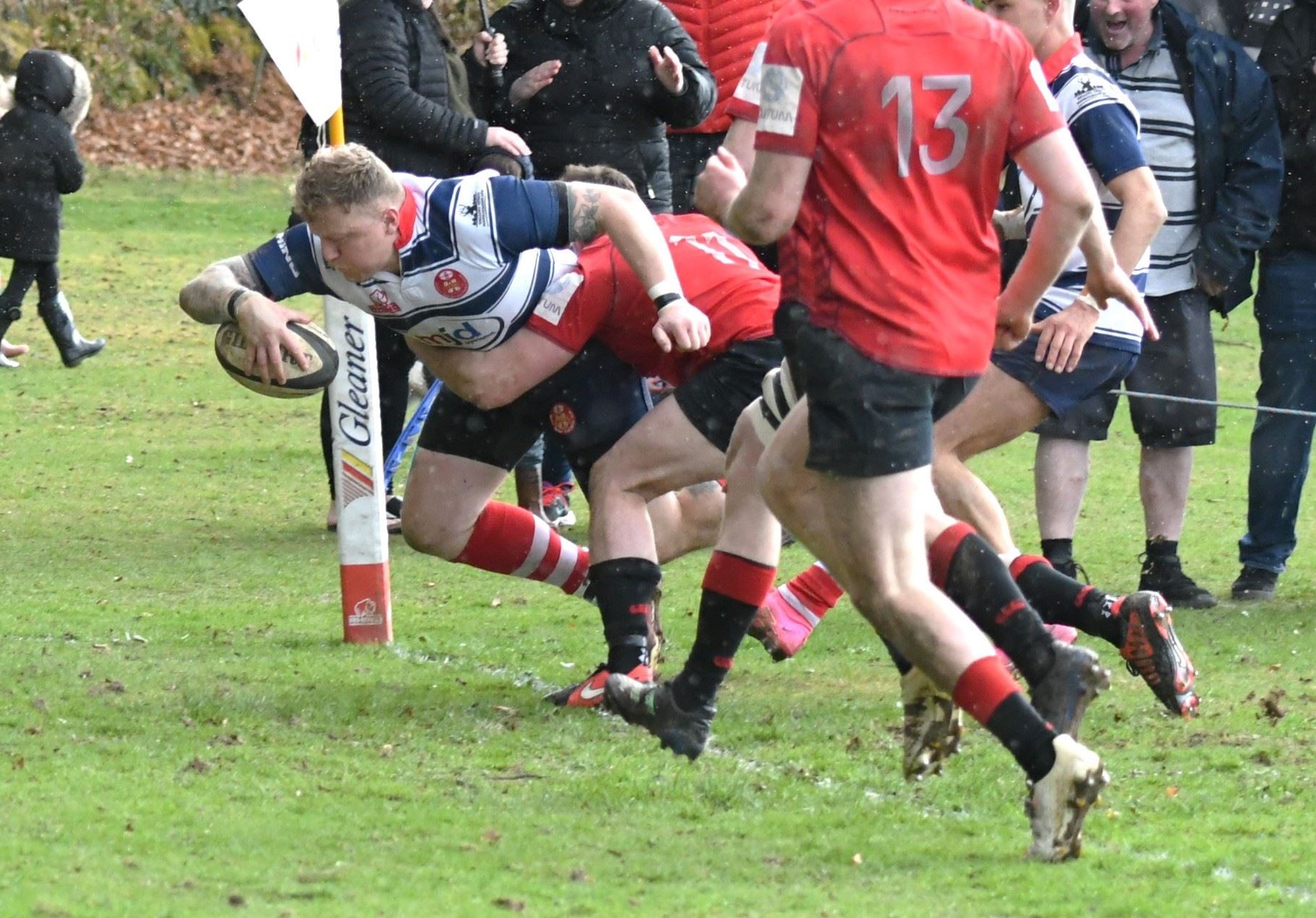 Lewis Scott bursts through to score Moray's sixth try. Picture: James Officer