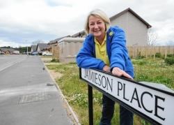 Lilian Lackie at one of two Elgin streets named in honour of her late mother, local swimming teacher and the face of the Munro Baths for many, Lily Jamieson.