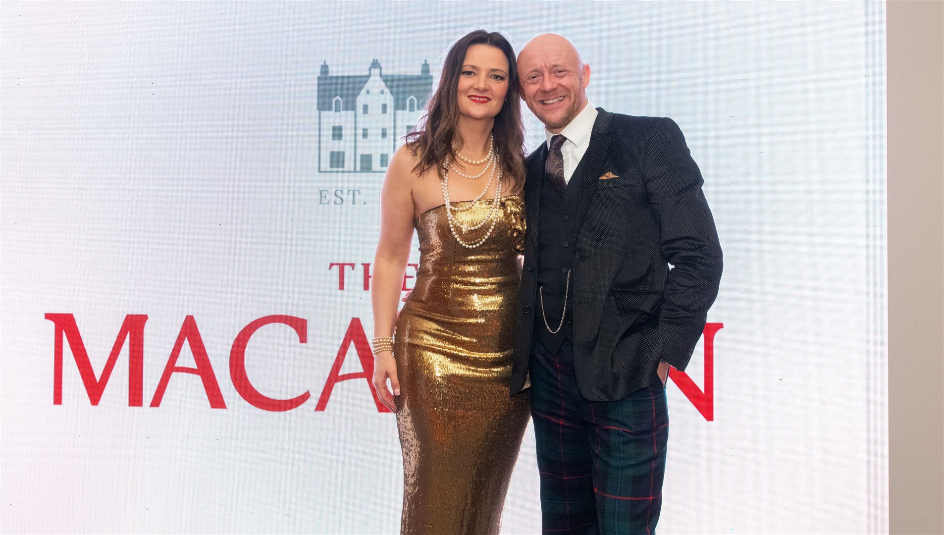 Chairman George McNeil with his wife, Laura McNeil. Spirit of Speyside Whisky Festival Opening Dinner 2024 held at The Macallan Distillery Estate. Picture: Beth Taylor