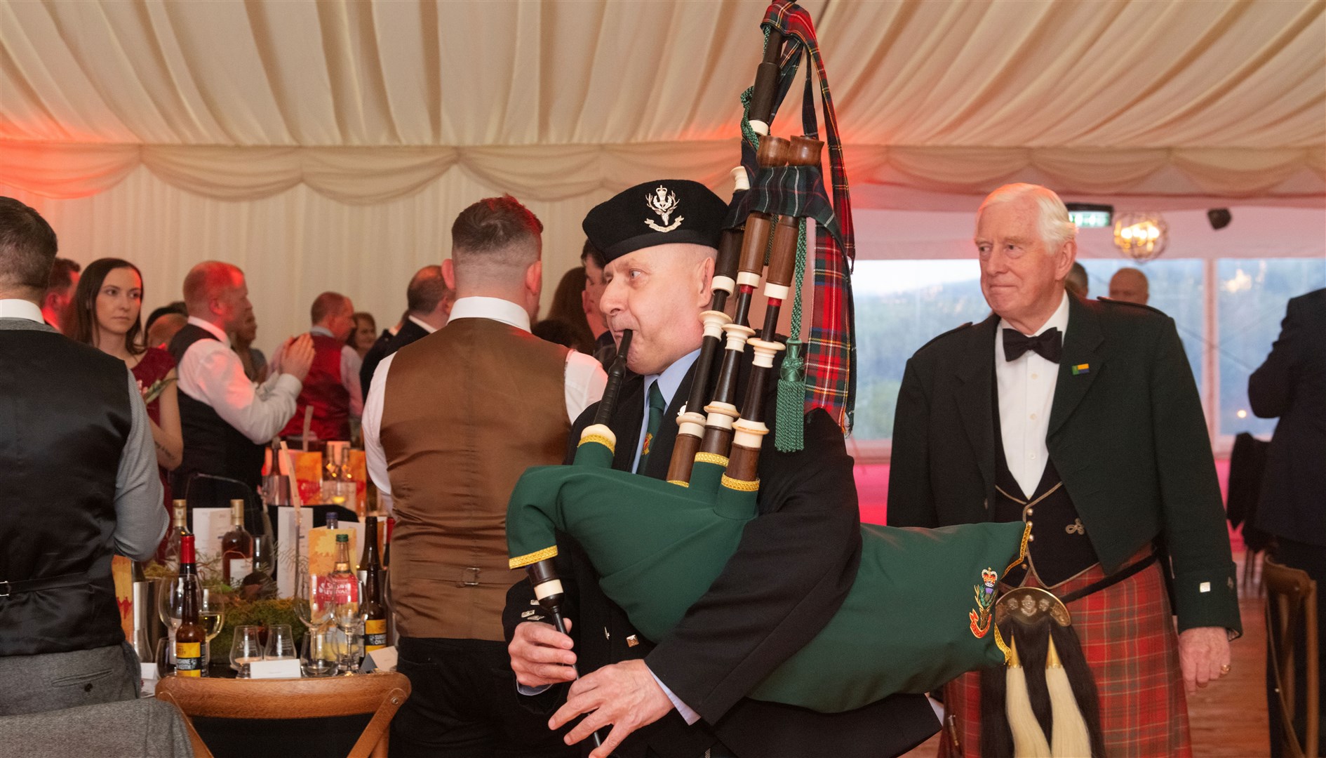Pipe Major Richard Anderson pipes in the top table. Spirit of Speyside Whisky Festival Opening Dinner 2024 held at The Macallan Distillery Estate. Picture: Beth Taylor