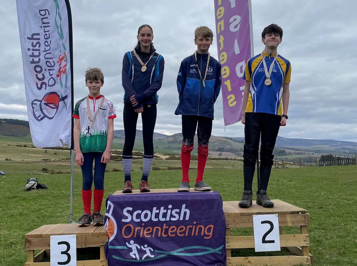 Anna Howard on top of the Scottish middle distance championships podium.