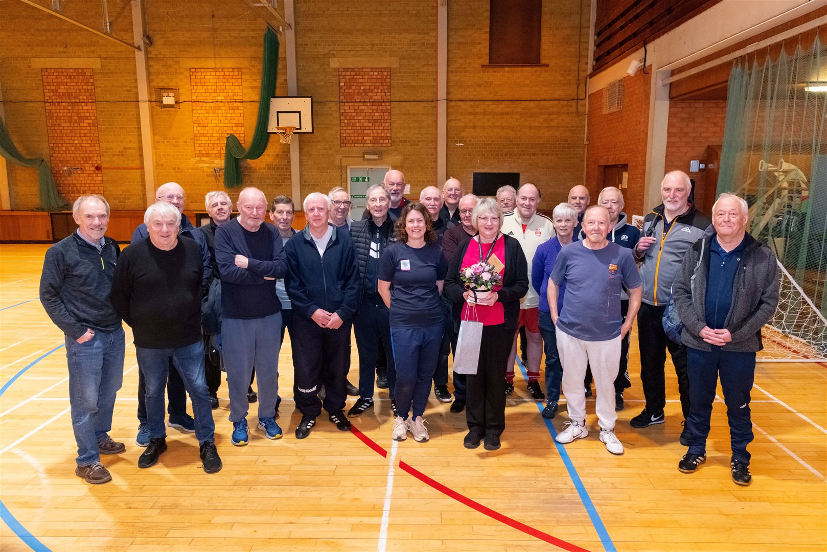 Walking football coach Lynn Grant (centre) with Margaret MacDonald and the Walking Football Club. Picture: Beth Taylor