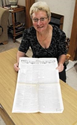 Dufftown woman Ann Robson with her 1843 edition of the ‘The News of the World’, authenticated by an antique expert. NS
