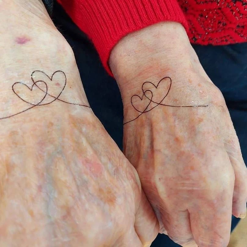 Geordie and Sheila Morrison opted for matching tattoos.