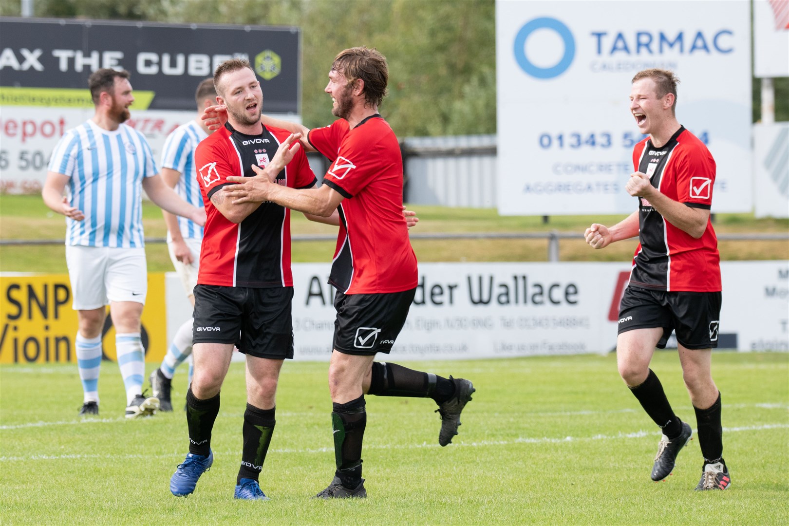 Kieron Ingram (left) is congratulated by team-mates George Duncan (centre) and Ryan Higgins. Picture: Daniel Forsyth
