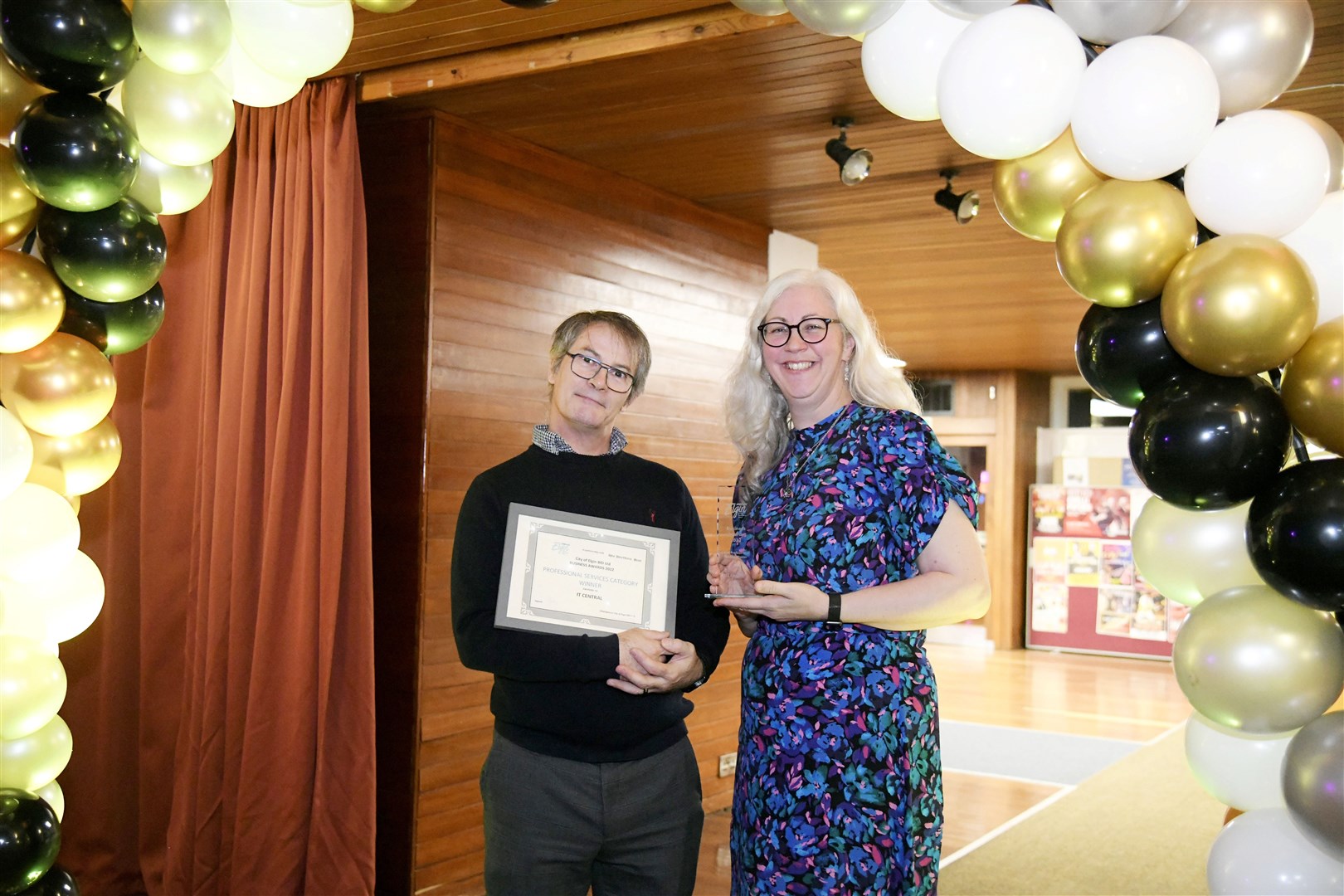 Lee Midlane, founder of IT central with her husband Grant with the local professional services award. Picture: Beth Taylor