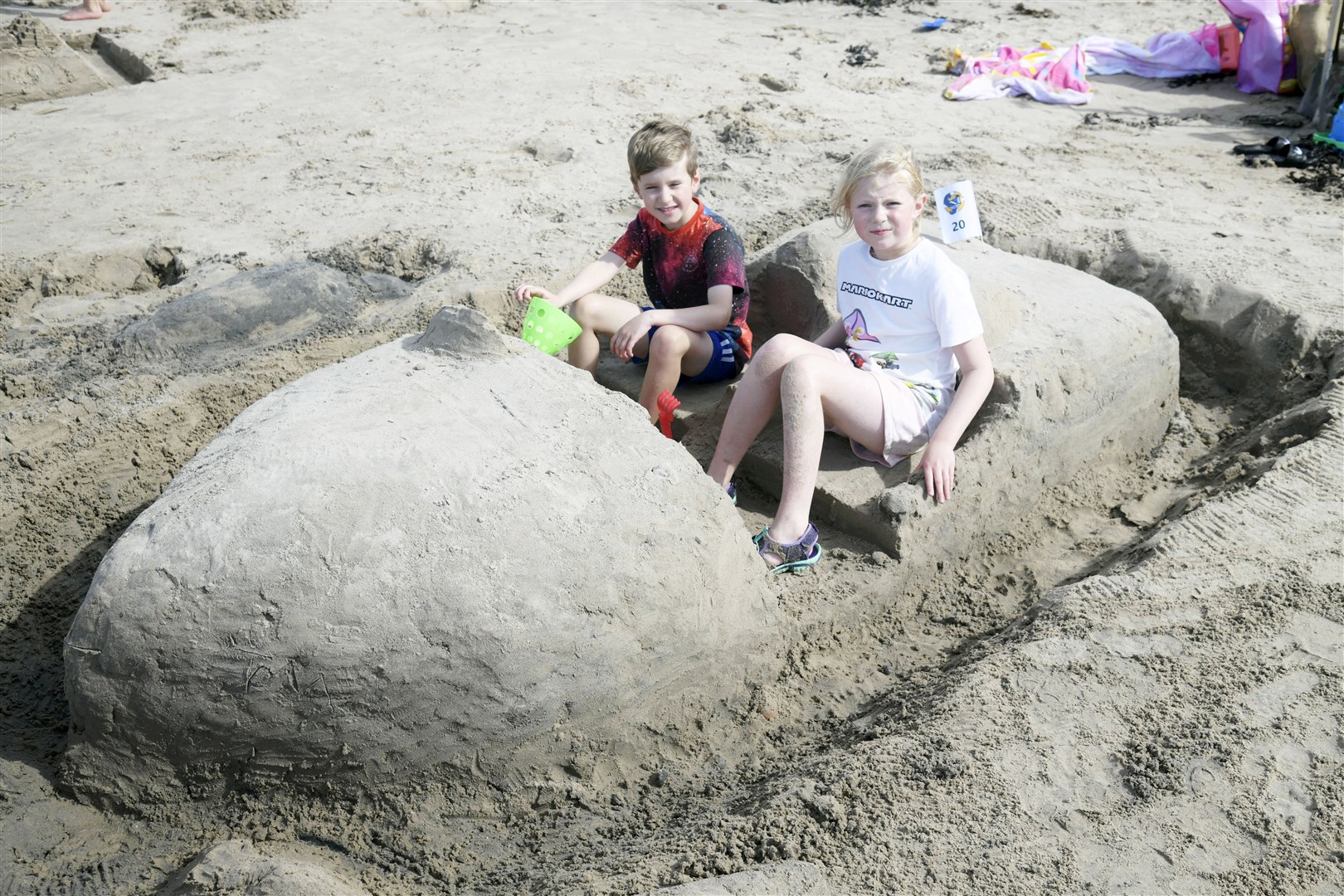 Tom Lewis (left) and Rosalind MacLeod (right) modelling their boat sandcastle at Seafest. Picture: Beth Taylor