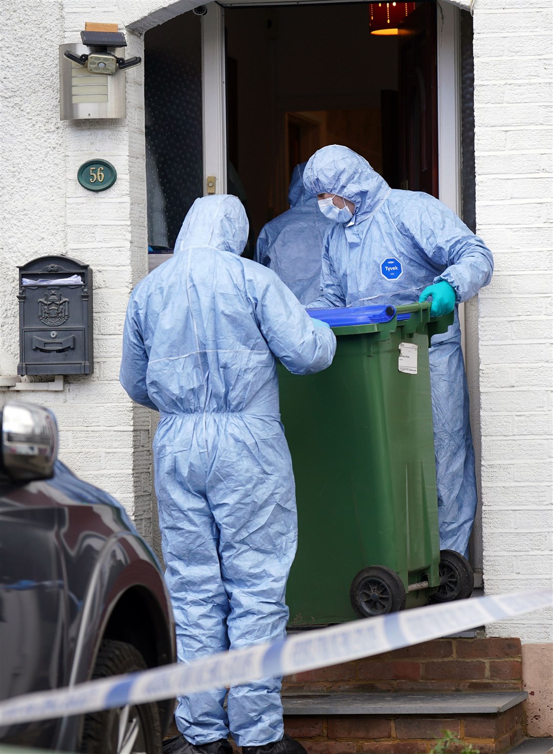 Police forensics officers at the property on Mayfield Road on Friday (Yui Mok/PA)