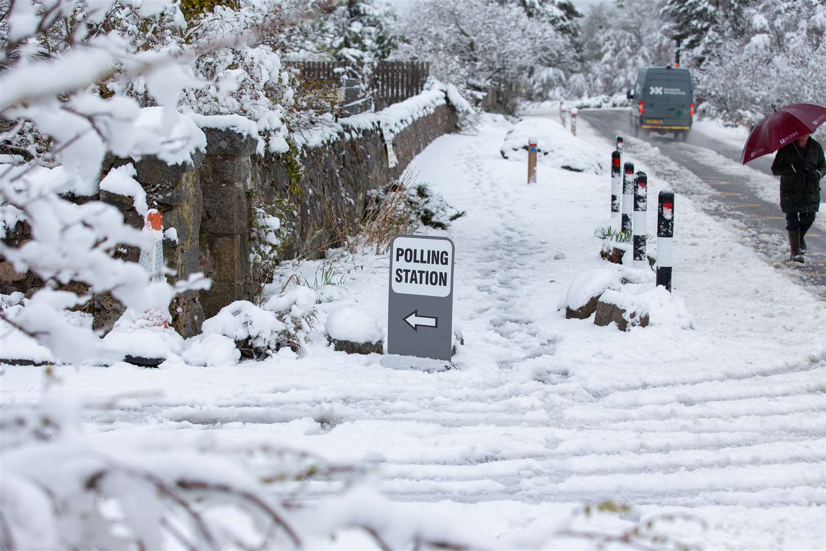 Voters in the village of Farr, near Inverness, had to contend with snow on their way to the polling station on Thursday morning (Paul Campbell/PA)