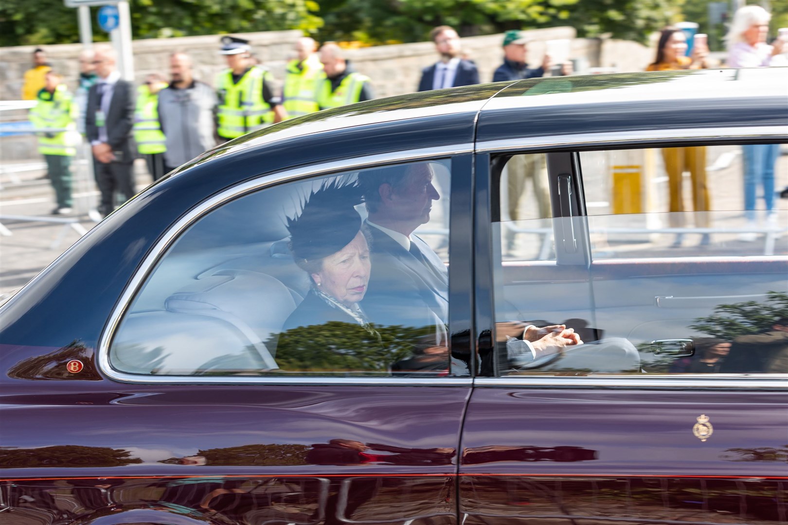 The Princess Royal and her husband Vice Admiral Sir Tim Laurence travel behind the hearse as it passes through Aberdeen (Paul Campbell/PA)