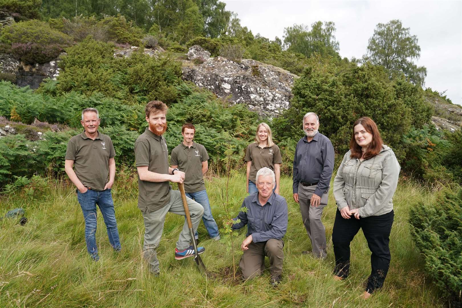 (From left) Trees For Life CEO Steven Micklewright, Trees for Life trainees Angus Crawley and Grymmsy Robinson planting the Rowan tree, Kat Murphy, rewilding centre education manager, Doug Gilbert, Dundreggan operations manager, Roddy Maclean and Laurelin Cummins-Fraser, Dundreggan Rewilding Centre director.