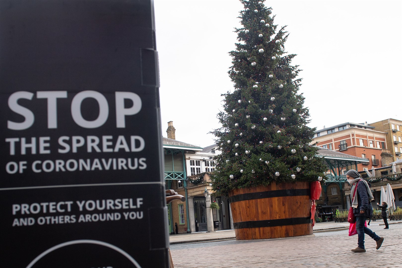Disinfecting parcels and sending cards early are among scientists’ recommendations for those wanting to take extra coronavirus precautions this Christmas (Dominic Lipsinki/PA)