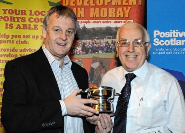 Peter Robertson (right) accepts his award from Neil Cruickshanks