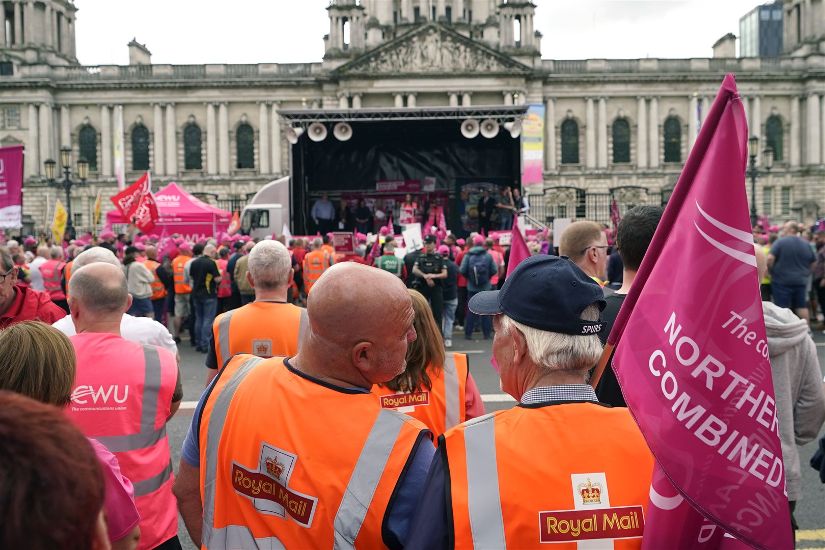 Members of the Communication Workers Union demonstrate during a strike rally outside Belfast City Hall (Niall Carson/PA)