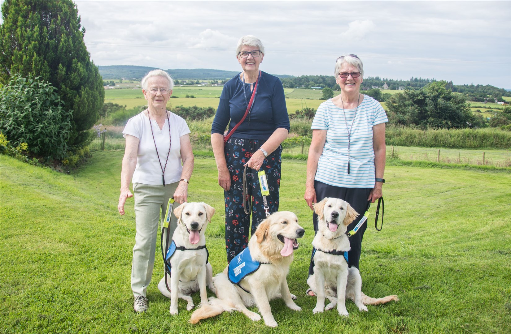 Puppy Walkers (from left) Margaret Woodward with Bramble, a Labrador/Golden Retriever cross; Morag Thomson with Hoover a Golden Retriever and Anne Simpson with Gizmo a Golden Retriever.Picture: Becky Saunderson. Image No. 044441.