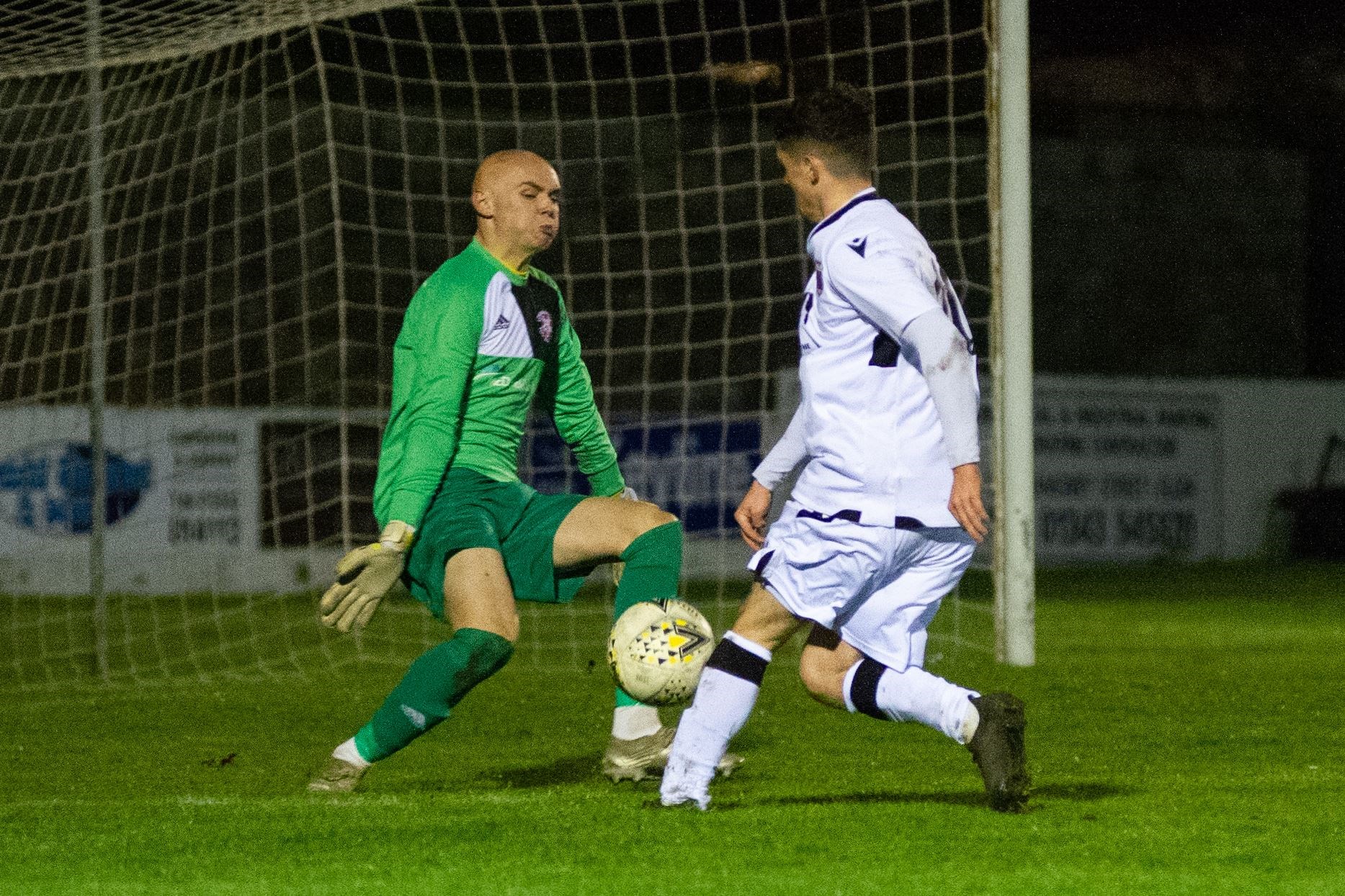 Another save from Lossiemouth keeper Logan Ross as he denies Rothes' Jack Brown...Lossiemouth FC (0) vs Rothes FC (1) - Grant Park, Lossiemouth 03/11/2021 - Highland Football League...Picture: Daniel Forsyth..