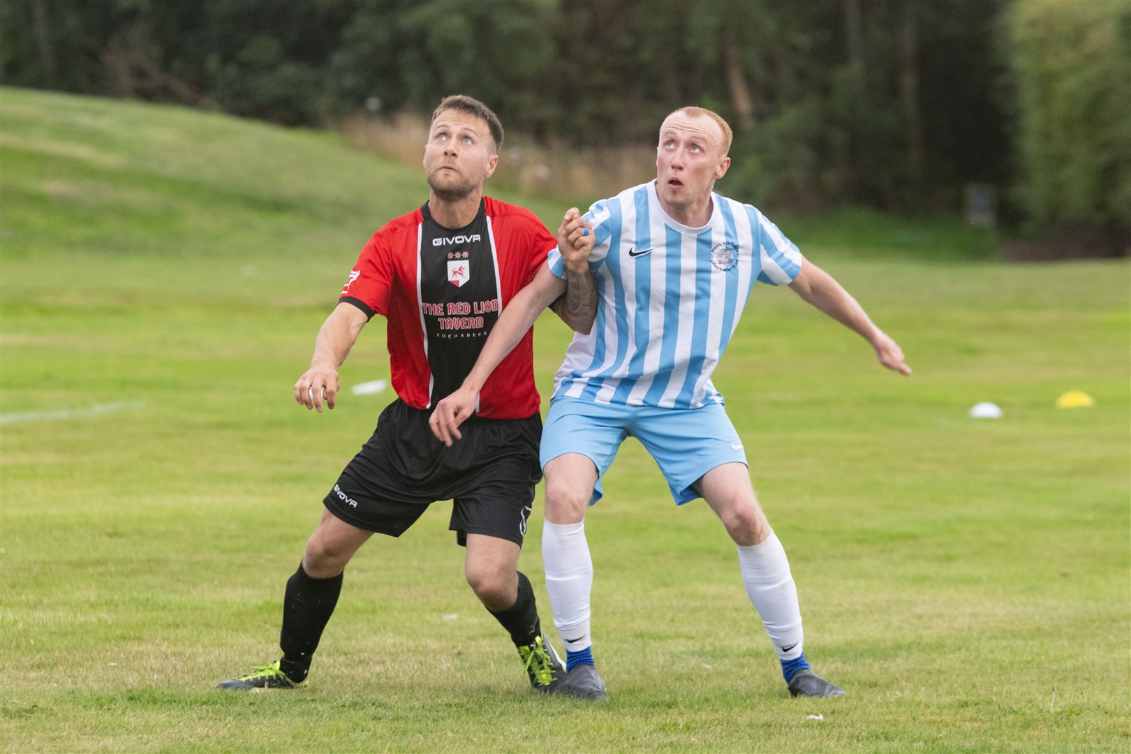 Eyes on the ball lads. RAF Lossiemouth's Cameron Newton and Fochabers' Aaron McLean.Picture: Beth Taylor.