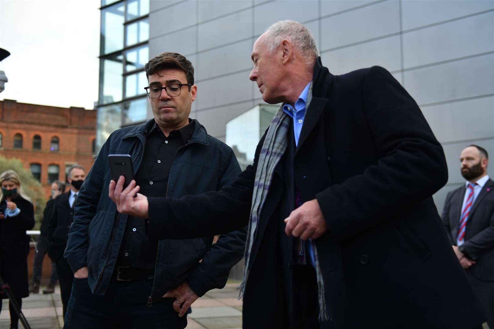 Greater Manchester mayor Andy Burnham (left) with leader of Manchester City Council Sir Richard Leese showing him when the measures will come into force (Jacob King/PA)