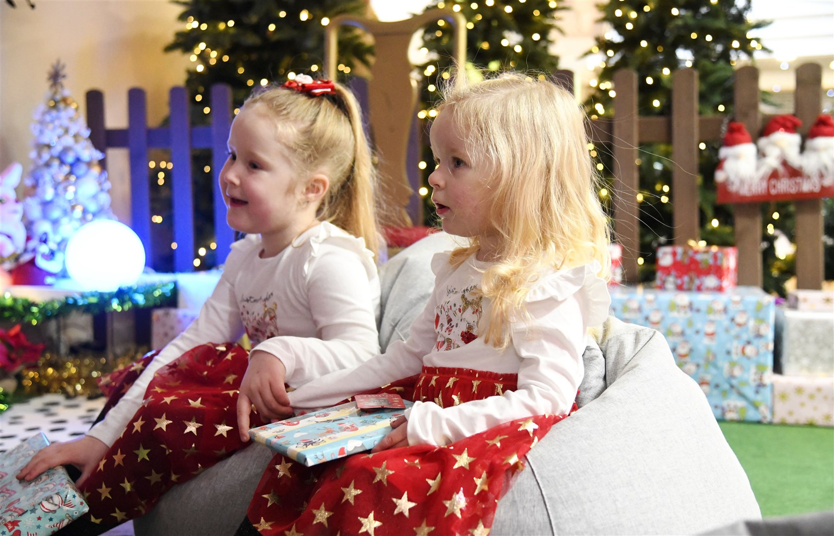 Amelia-May (left) and Merida Forrest (right) enjoying their visit to see Santa at his Grotto in the St Giles Centre in Elgin...Pictre: Beth Taylor.