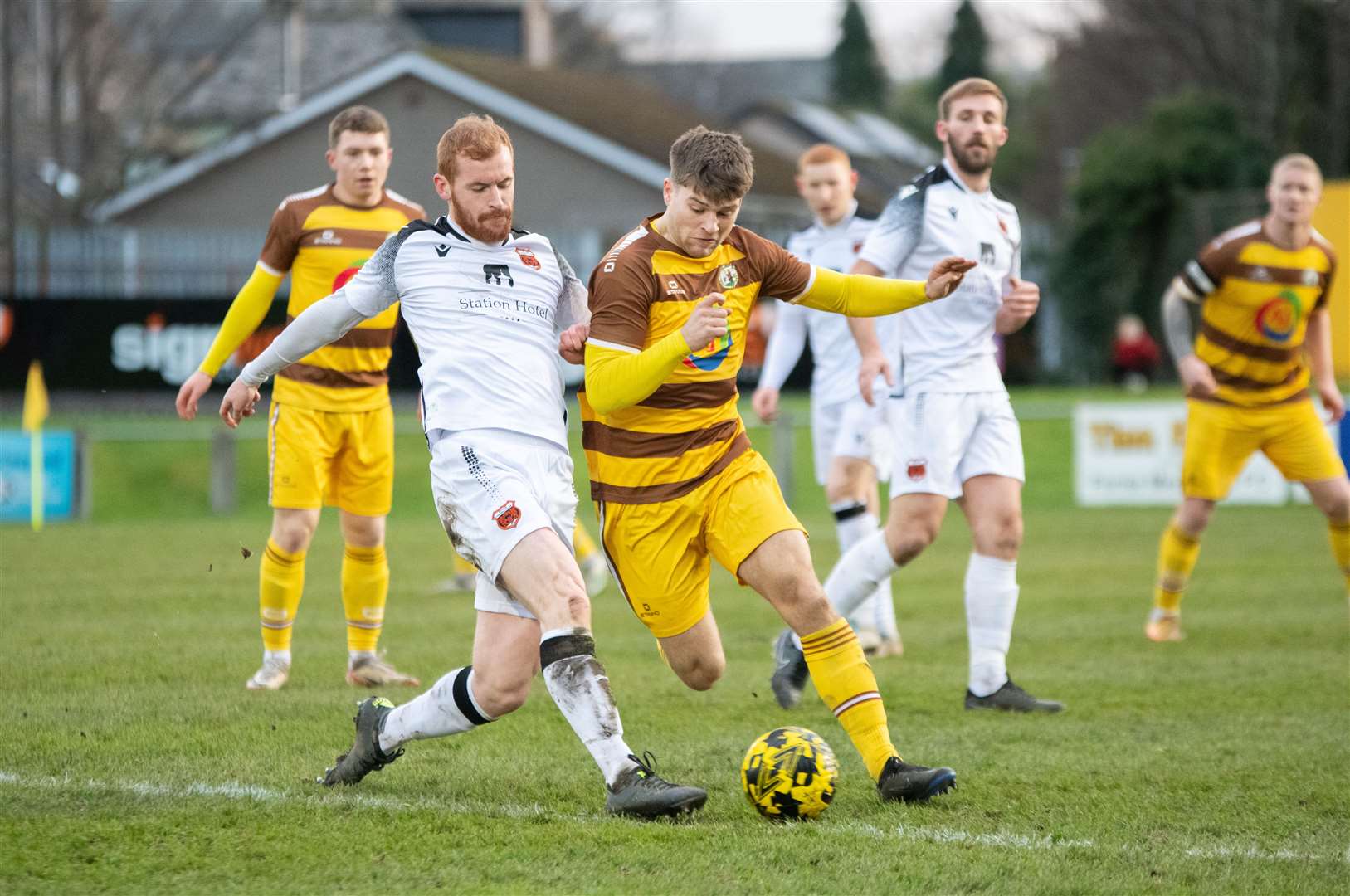 Rothes forward Greg Morrison gets a foot on the ball to stop Forres' Jack Grant advancing up the park. ..Forres Mechanics FC (0) vs Rothes FC (1) - Highland Football League 23/24 - Mosset Park, Forres 25/11/2023...Picture: Daniel Forsyth..