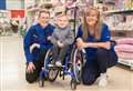 Tesco staff raise money to provide specialist equipment for inspirational Moray child