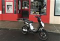 Electric scooter saving time, fuel and money for Lossie newsagent