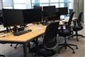 Government staff work in corridors over desks shortage