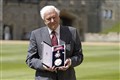 Sir David Attenborough beams as he collects high honour from Prince of Wales