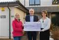 Richard Lochhead presents Moray Women's Aid with cheque for £1900 