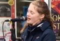 Singer Lucy Lloyd entertains lunchtime shoppers in Elgin