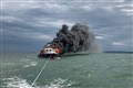 Two rescued after motor cruiser catches fire and sinks