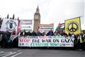 Police and protesters clash as 100,000 take part in pro-Palestinian London march