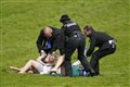 Animal activists taken away by police after running on track at Epsom Derby