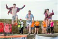 Sixty take plunge in annual Burghead harbour jump