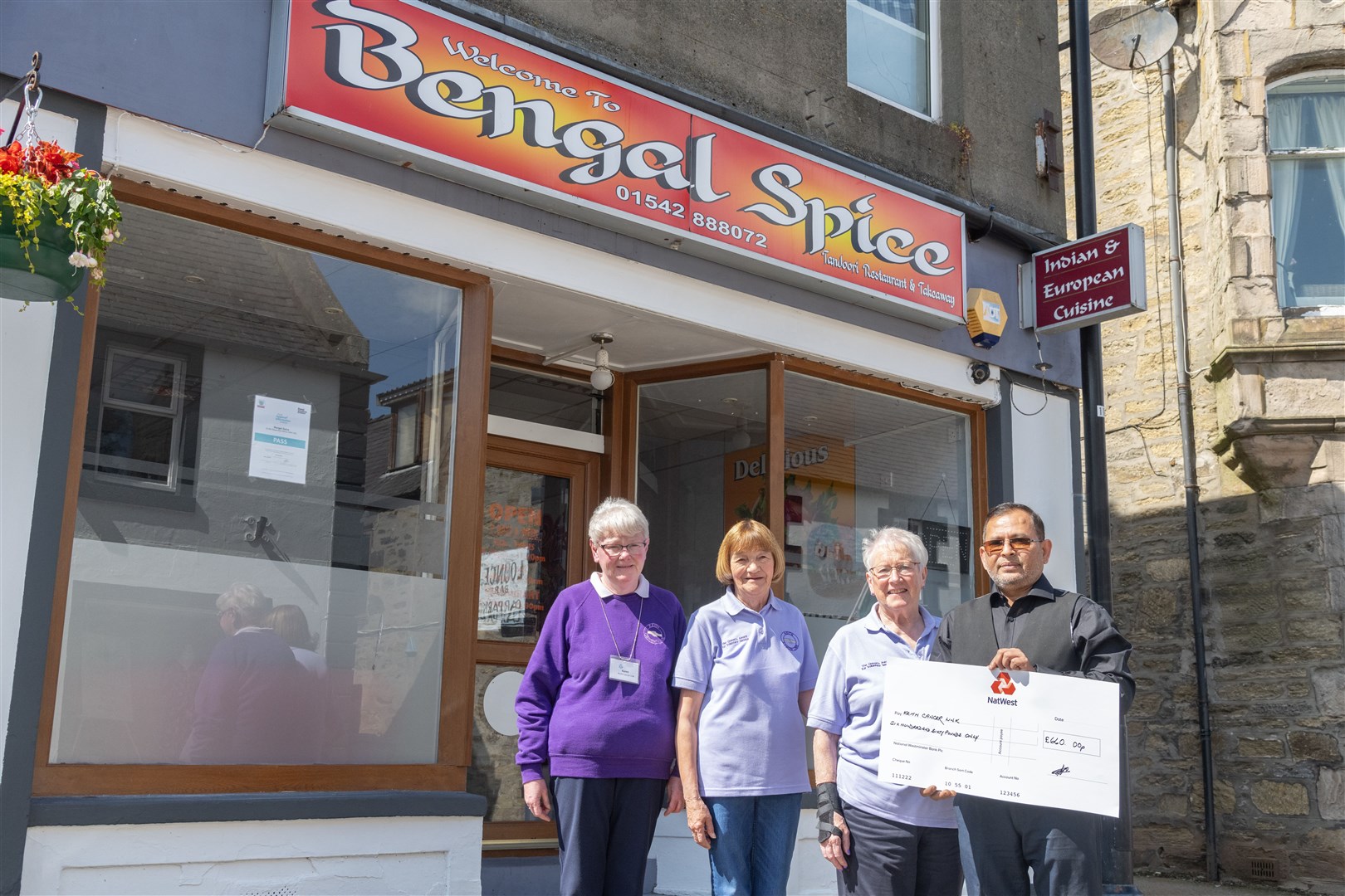 From left: Karen Simpson, Isobel Sadowski and Adeline Reid from Keith Cancer Link receiving a cheque for £660 from Abdul Aziz, owner of Bengal Spice. Picture: Beth Taylor.