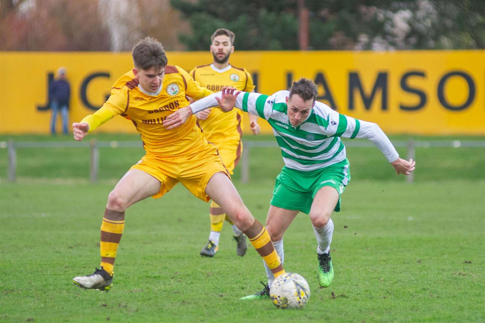 Forres Mechanics' Declan Hughes and Buckie Thistle's Kevin Fraser tussle for the ball. ..Forres Mechanics FC (2) vs Buckie Thistle FC (2) - Highland Football League - Mosset Park, Forres 08/02/2020...Picture: Daniel Forsyth..