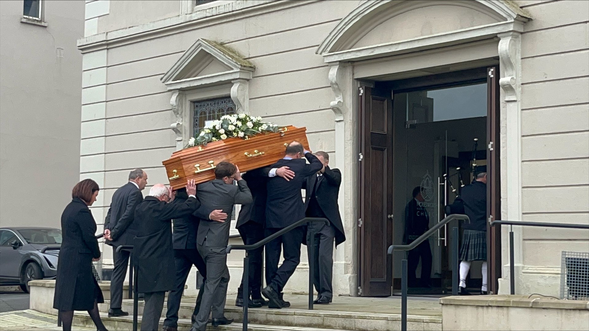 The coffin of Maud Kells is carried into Molesworth Presbyterian Church in Cookstown (Claudia Savage/PA)