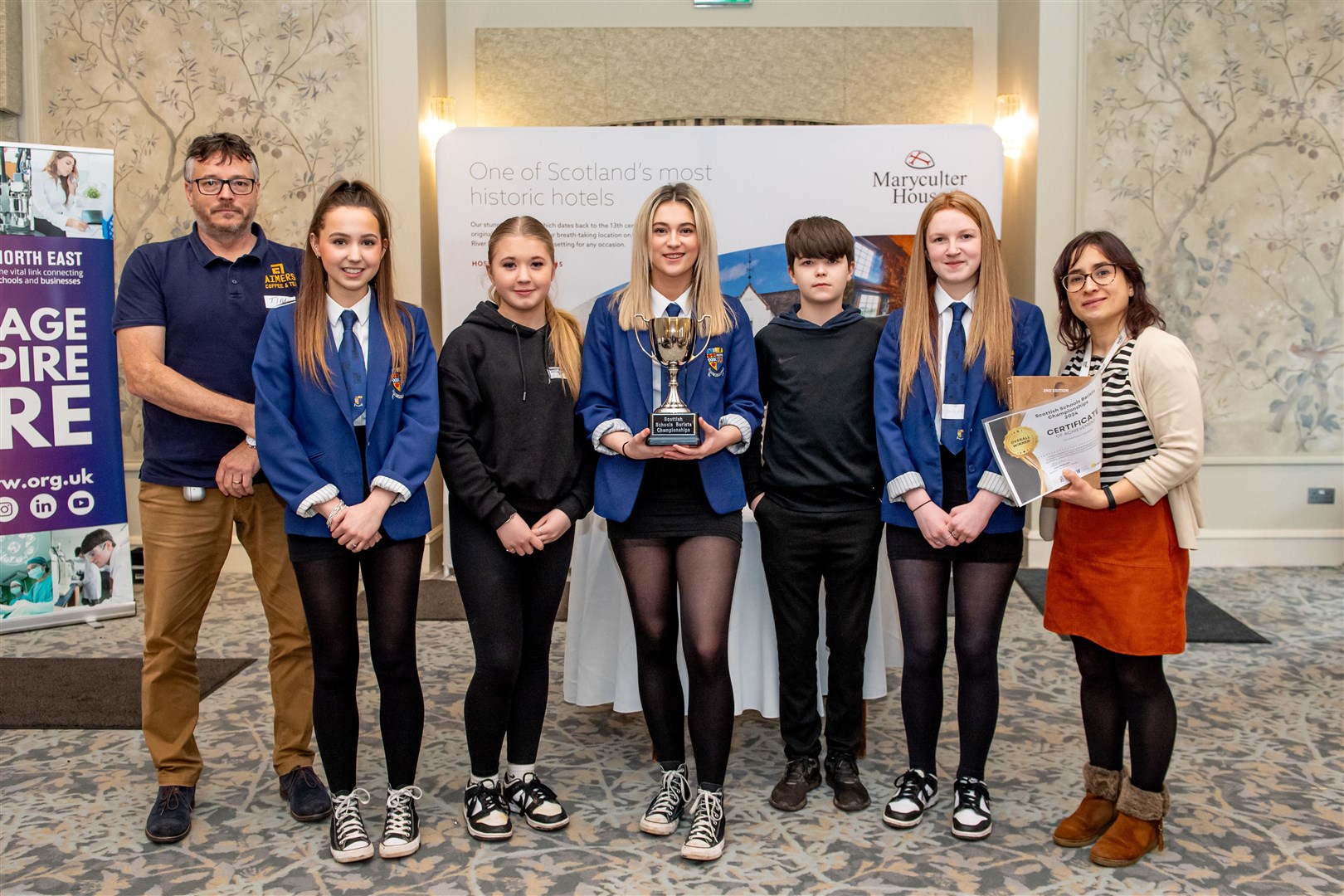 The winning team from Inverurie Academy with judge Tim Sturk. Picture: ABERMEDIA