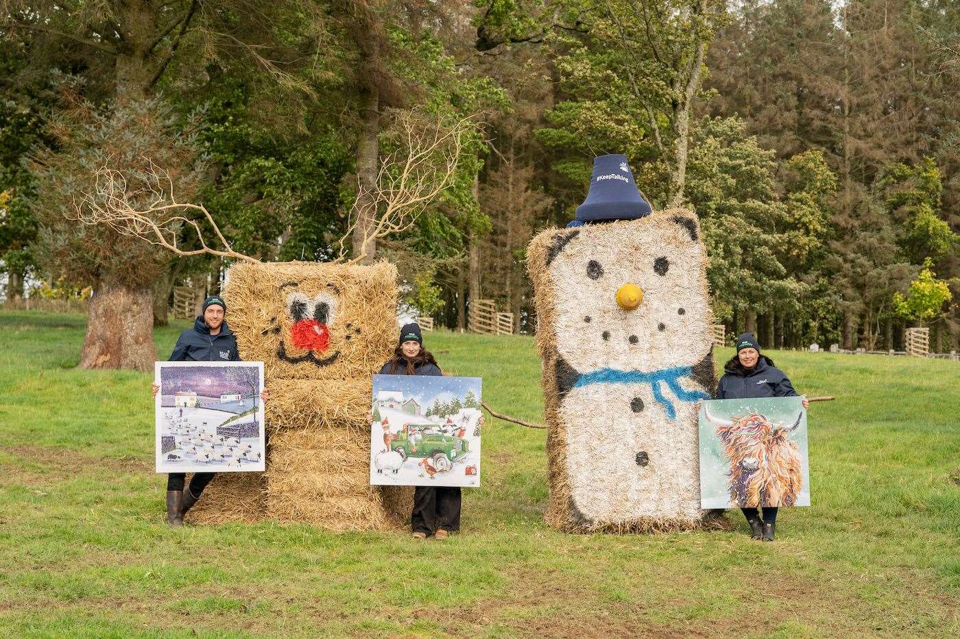 RSABI’s Gregor Wilson (left), Julia Bell (middle) and Pauline Macmillan (right) pictured with Christmas card designs and festive bale art creations to celebrate launch of RSABI’s 2023 winter fundraising campaign.