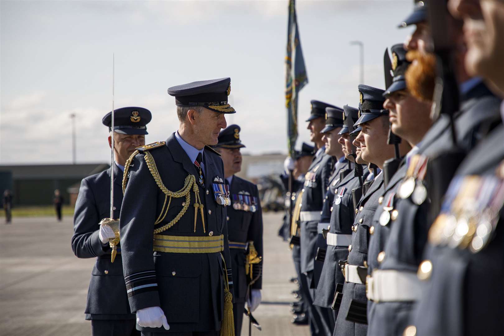 Deputy Commander Operations (DCom Ops), Air Marshal Gerry Mayhew inspects the parade of 120 Squadron, accompanied by the Station Commander of RAF Lossiemouth, Group Captain Chris Layden, and the Officer Commanding 120 Squadron, Wing Commander James Hanson.