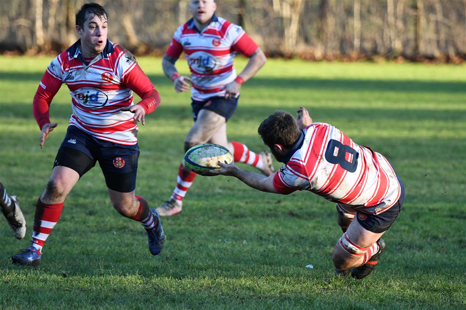 Neil Alexander offloads to Cameron Hughes in tackle. Picture by James Officer