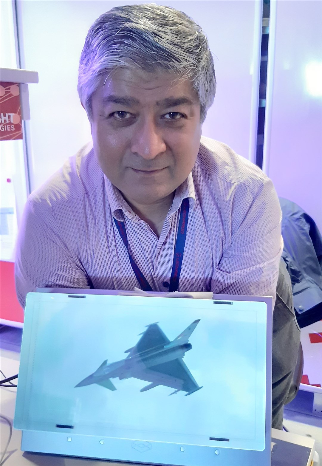Dr Javid Khan with a holographic 3D display showing a Typhoon model.