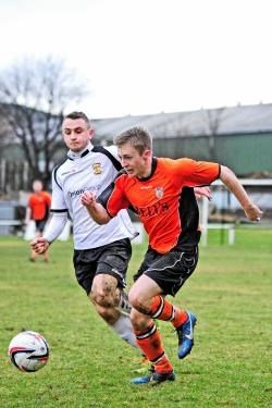 Rothes winger Callum McIntosh (right) tries to outrun Paul Brindle. Photo by Daniel Forsyth.