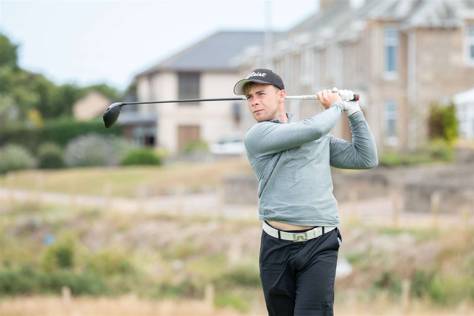 Current holder Matty Wilson drives off the third hole on Moray's old course. Picture: Daniel Forsyth..