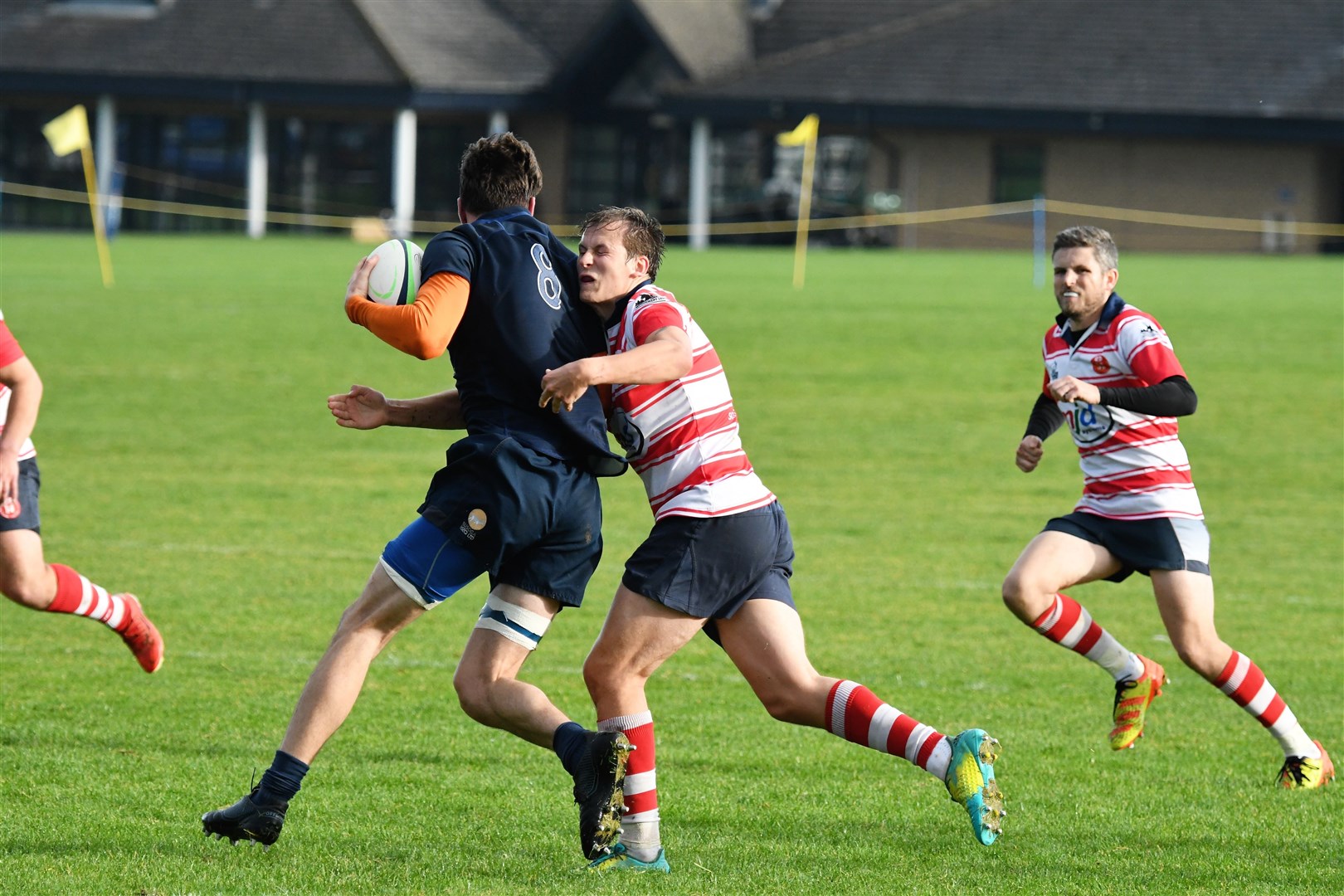 Cameron Ireland tackles as brother Douglas watches on. Picture: James Officer