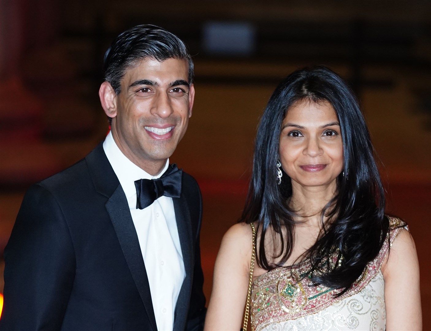 Rishi Sunak with his wife, Akshata Murty, who retained her ‘non dom’ status (Ian West/PA)