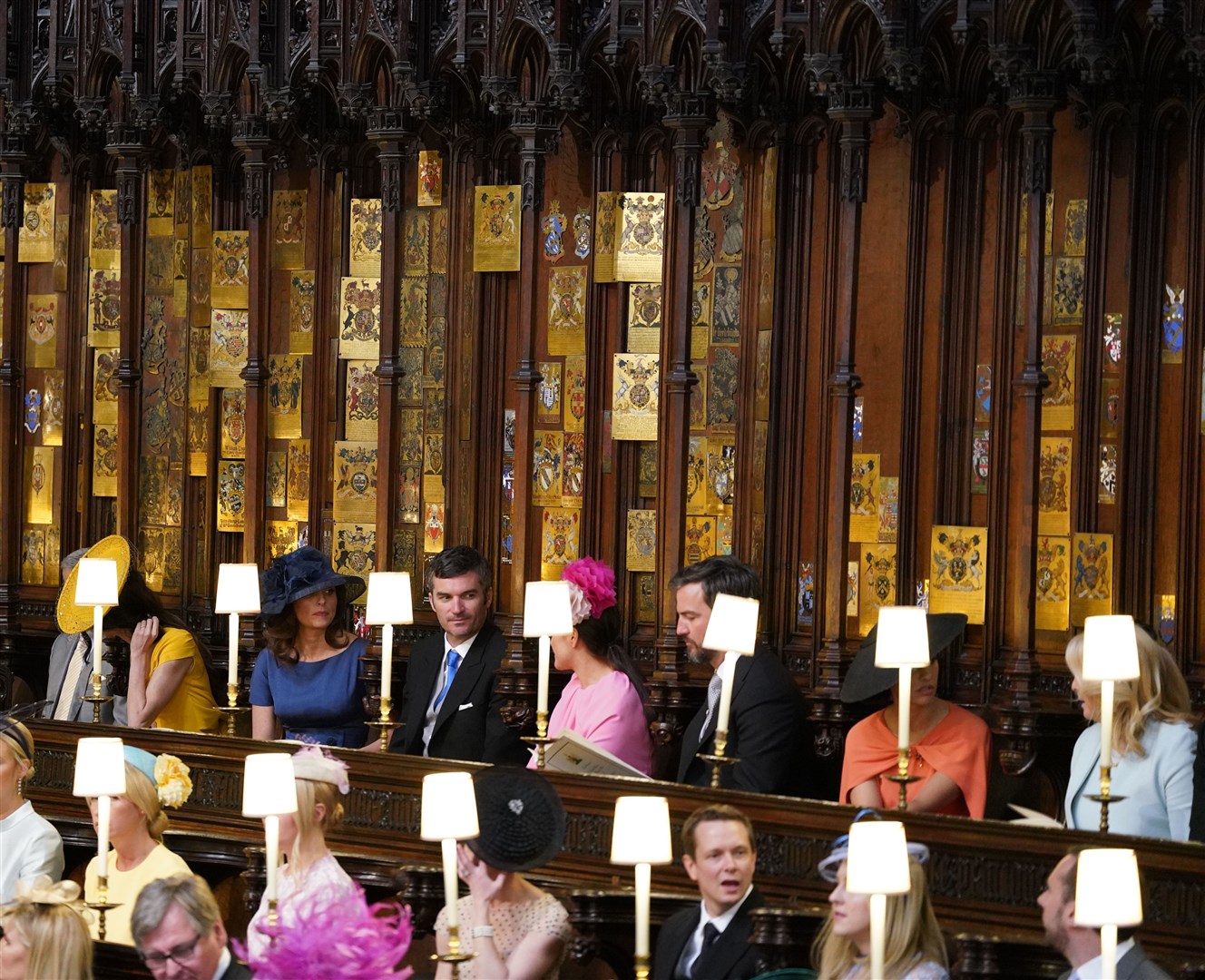 (Left to right, back row) George Clooney, Amal Clooney, Silver Tree, Abraham Levy, Celine Khavarani, Markus Anderson, Janina Gavankar, and Jill Smoller in St George’s Chapel for Harry and Meghan’s wedding (Dominic Lipinski/PA)